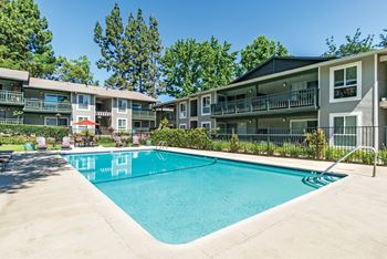the swimming pool at the falls at rolland park apartments  at Pleasanton Glen Apartments, California
